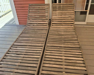 Lot 71: Pair of wooden slatted lounge chairs