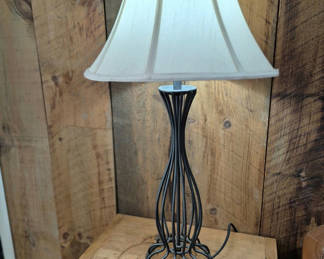 Lot 74: Two table lamps with sculpted metal base and white shades