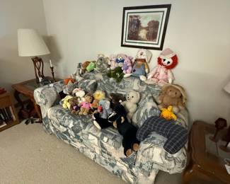 Assorted Stuffed Animals on Sofa
