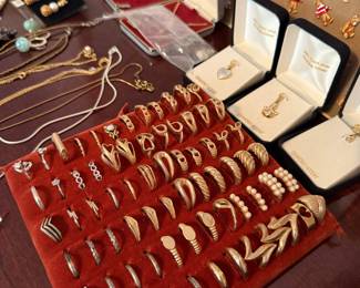 Assorted Gold and Silver Tone Rings and Pendants