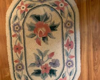 #68 oval hooked rug 32x20 $25.00