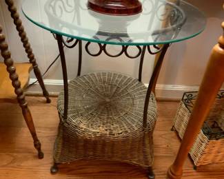 #85 glass and metal/wicker round table 20x22 $30.00