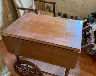 #18 flip side tea cart on wheels 28x19-40x29 $120.00