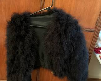 #50 black feather jacket size med $25.00