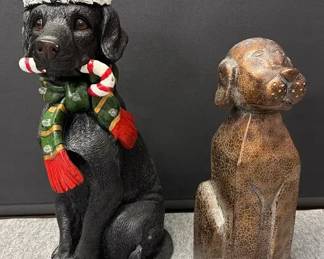 A Tail Wagging Christmas Featuring Two Large Dog Statues
