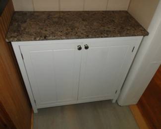Narrow marble top cabinet