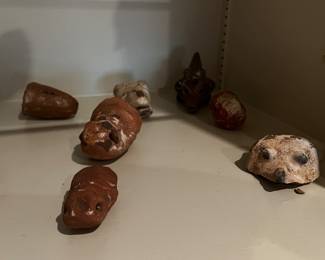 Pre-Columbian or Mayan artifacts with small terracotta figurines and vessel