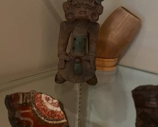 Pre-Columbian or Mayan artifacts with small terracotta figurines and vessel