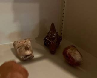 Pre-Columbian or Mayan artifacts with small terracotta figurines and vessel