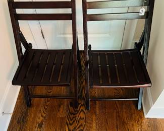 M35 - $25 PAIR of wooden folding chairs. Both sturdy and in good condition.
