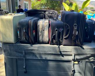 20 or so suitcases from 1960's to present