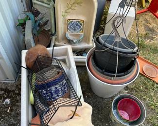 Multiple garden fountains and plant pots