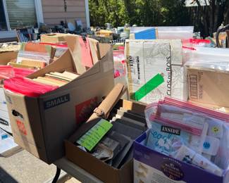 Boxes of ephemera including vintage photographs, post cards, travel brochures and sheet music