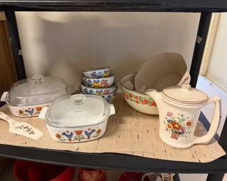 Corningware "Country Festival" casserole dishes; white porcelain nesting bowls; Harker Pottery "Petit Point" floral pattern pitcher