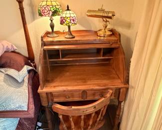 Wooden roll top desk with chair; Tiffany style rose lamps; brass desk lamps