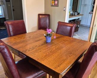 Oak table with three leaves/ set of leather dining room chairs