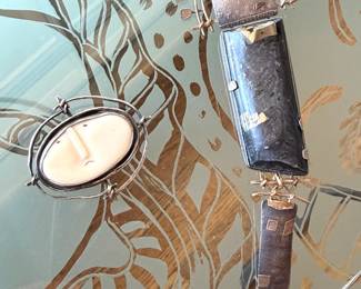 Carolyn Morris Bach necklace and two brooches made of sterling, 18kt gold and various stone