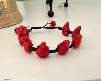 Vintage carved red coral in the shape of turtles