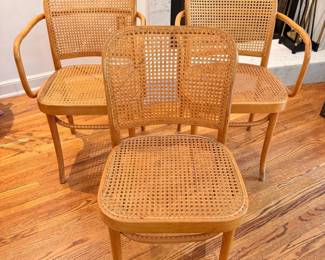 Ca. 1960’s iconic cane bentwood chairs by Josef Hoffman.  There is some very small cane damage to the two arm chair backs 