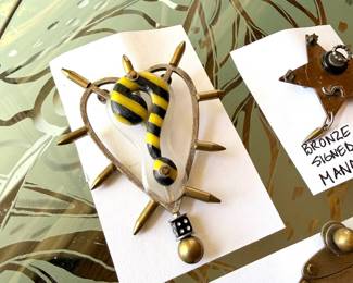 Fun selection of vintage Thomas Mann custom made jewelry including a Techno-Romantic bronze teapot brooch