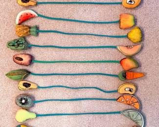 Set of 12 unique artist made “napkin rings”