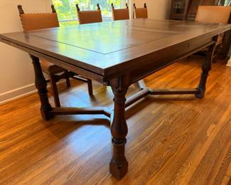 Antique Jacobean style dining set.  This set comes with 10 dining chairs and 2 captains chairs