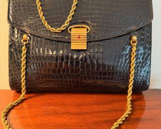 Incredible and rare Cartier handbag ca. 1930’s with 18kt gold hardware throughout and one small ruby on clasp.  The gold hardware and ruby have been tested by a renowned local Jeweler
