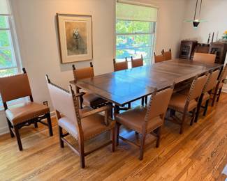 Antique Jacobean style dining set.  This set comes with 10 dining chairs and 2 captains chairs