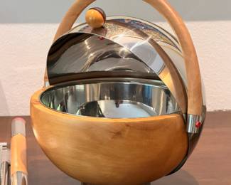 Extremely rare MCM style ‘Futura’ serving set designed by Larry Laslo for Towle Silversmiths.  This set features polished stainless steel with wood accents and is in incredible, mostly unused, vintage condition. 
