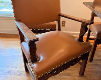 Antique Jacobean style dining set.  This set comes with 10 dining chairs and 2 captains chairs