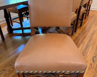 Antique Jacobean style dining set.  This set comes with 10 dining chairs and 2 captains chairs