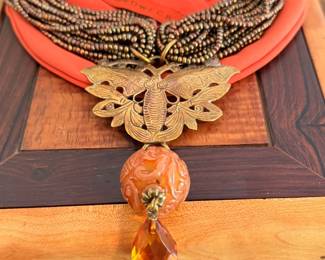 Vintage Stephen Dweck necklace fearing carved jade, brown pearls, Briollet amber drop and a bronze butterfly