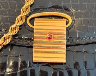 Incredible and rare Cartier handbag ca. 1930’s with 18kt gold hardware throughout and one small ruby on clasp.  The gold hardware and ruby have been tested by a renowned local Jeweler