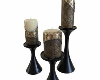 Set of Metallic Banded Pillar Candles on Modern Black Candlesticks