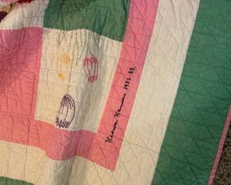 Same quilt with embroidered flowers