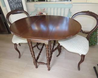 Antique gate leg table and two chairs.