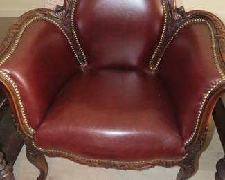 One of two matching leather armchairs.