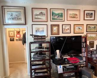 This is the main living room technology stack and it’s pretty incredible too high-end Sandi pieces here and the techniques record player as well as double tape deck and some other high-end components… Again this is a drop in the bucket compared to the full audiophile room