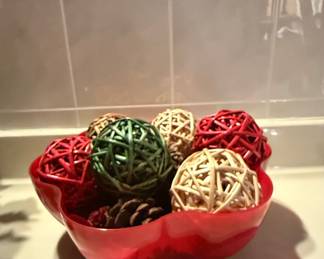 Decorative Rattan Balls and Pine Cones in a Red Scalloped Bowl