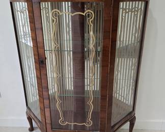 curved glass display cabinet with the gold decorative glass pattern
