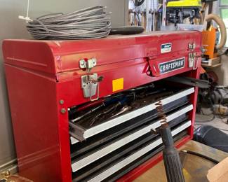 Tons of tools, toolboxes and work benches.