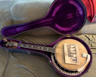 mid 1920s 4 string tenor banjo by Lyon and Healy (Washburn) with an ebony and mother of pearl neck and a mahogany resonator, with original case, overall good condition but the resonator needs a screw