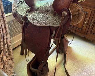western style saddle with richly tooled leather