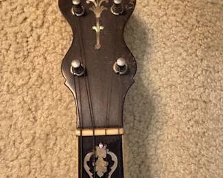 mid 1920s 4 string tenor banjo by Lyon and Healy (Washburn) with an ebony and mother of pearl neck and a mahogany resonator, with original case, overall good condition but the resonator needs a screw