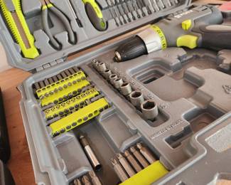 Drill in Box and Tools. 