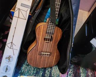 Kala Pacific Walnut Ukulele and Soft Cover and Uke Music. Music Stand 
