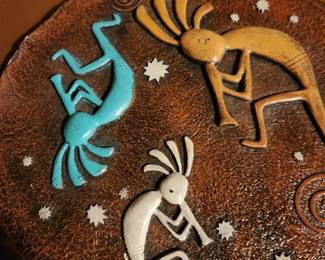 Kokopelli Dancers on Metal Plate. 