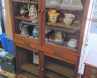 Glass Front China Cabinet with Side and Hidden Compartments