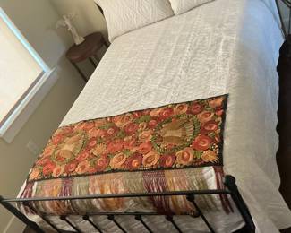 Queen sized black metal bed, with mattress and boxspring.