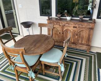 Outdoor patio set of table and 4 chairs, with cushions, and Indonesian wood sideboard. 
